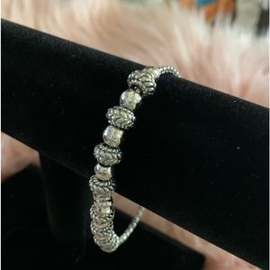 JAI STERLING SILVER SYMBOLS OF LOVE ADJUSTABLE BRACELET.